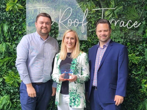 From left to right; Luke, Clair and Oliver from the Marketing team at Delga Press holding the award for self promotional print.